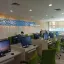 Area baca Perpustakaan Nasional RI—deretan meja, kursi, dan jendela besar yang terang